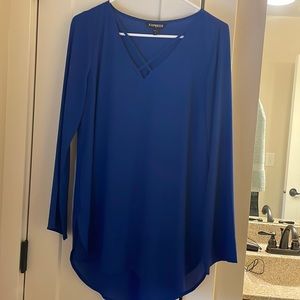 Express silky blouse with crisscross kneckline.